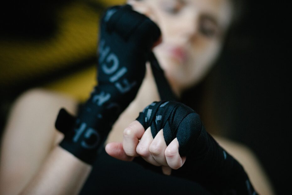 female fighter wrapping hands